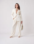 URMI DAGGA IN OUR RELAXED WIDE-LEG TROUSERS